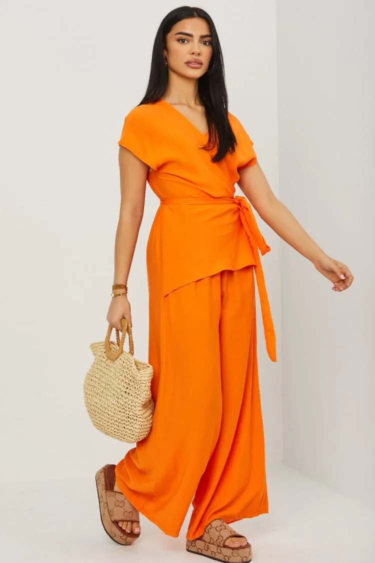 Combinaison pantalon orange décolleté croisé a noué